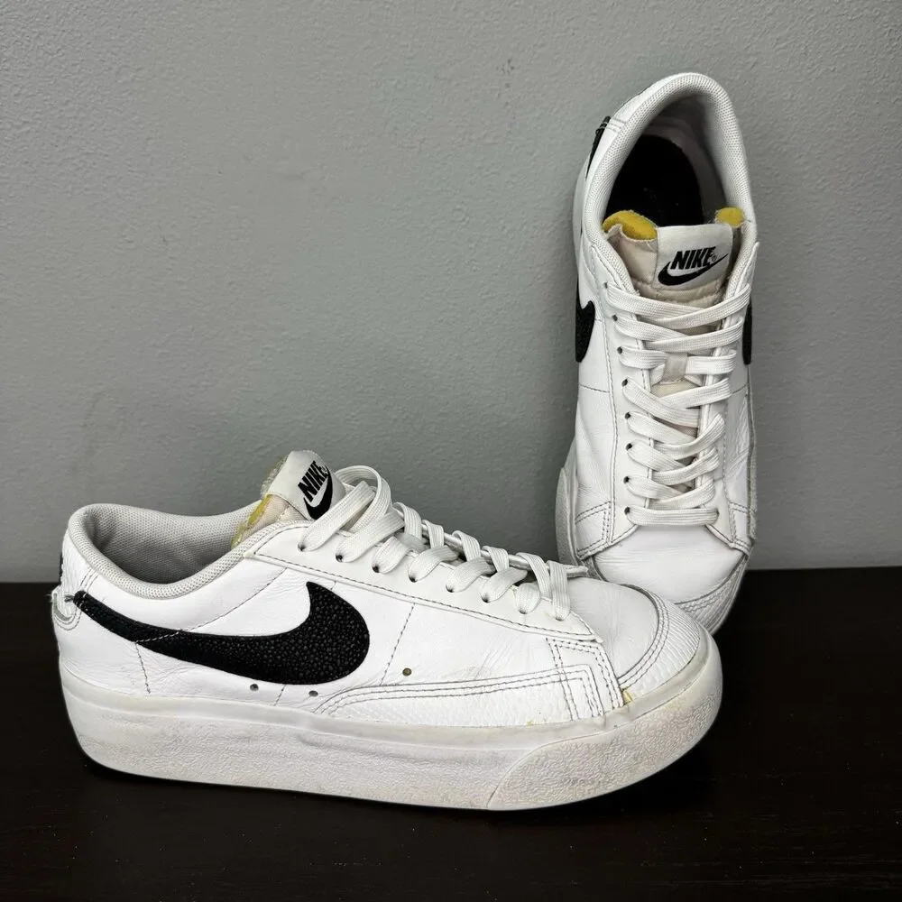 Nike White Leather Low-Top Sneakers with Black Swoosh and Yellow Tongue